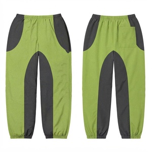 Pantalon coupe-vent réversible en coton tissé 120 GSM de qualité supérieure, vert et gris avec empiècements contrastants, poignets élastiques et cordon de serrage - Product Image 1