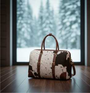 กระเป๋าเดินทางหนังวัวแท้ขนสัตว์แบบหรูหรา กระเป๋าถือแบบดัฟเฟิลสำหรับวันหยุดสุดสัปดาห์ กระเป๋าเดินทางขึ้นเครื่องบิน ผู้ผลิต OEM ขายส่ง LHTB-0078 - Product Image 1