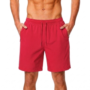 Shorts décontractés pour hommes, couleur rouge unie, style streetwear, taille élastique, poche arrière avec fermeture éclair, 100% coton, séchage rapide et imperméable - Product Image 1