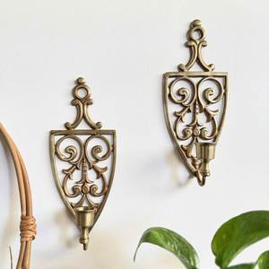 Candelabro de metal decorativo hecho a mano con diseño artístico de hierro para decoración de pared en hogares modernos. - Product Image 1