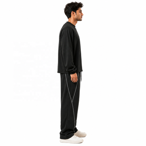 Ensemble de survêtement unisexe d'hiver en coton tricoté 100 %, comprenant un sweat à capuche oversize et un pantalon de jogging à jambe large avec passepoil contrastant, coupe décontractée - Product Image 2