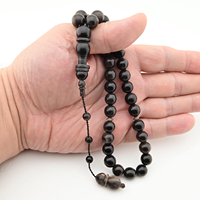 Tasbih unique en corail noir du Golfe d'Arabie |   Perles de prière Yusr rares avec accents de corail doré |   Tournerie égyptienne artisanale