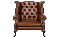 Luxuriöser brauner Leder-Flügelstuhl (Wingback) mit tiefer Knopfheftung, Nagelkopfverzierung und klassischem Design für das Wohnzimmer