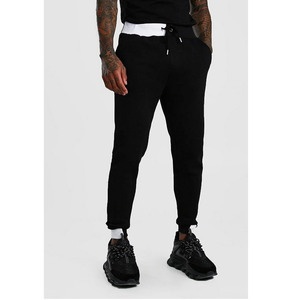 Pantalon de survêtement bleu pour homme avec bandes latérales blanches et poches zippées, style décontracté urbain - Product Image 2