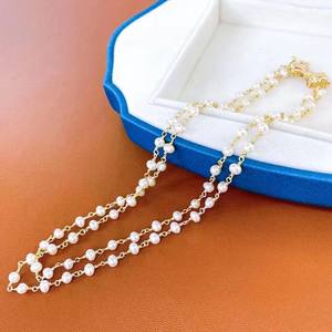 Collier en perles d'eau douce à double couche de conception française, style rétro léger et luxueux avec nœud, niche - Product Image 1