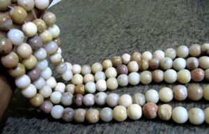 ลูกปัดโอปอลสีชมพูธรรมชาติทรงกลมเรียบเนียนขนาด 10 มม. ความยาว 13 นิ้ว - Product Image 6