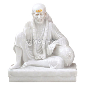 รูปปั้นมาร์เบิล ดวาร์กามัย ไซบาบา |   รูปปั้นพระศรีศิริไสบาบาหินอ่อนสีขาวนั่งบนหิน – มาลียาส - Product Image 1