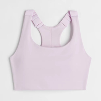 Soutien-gorge de sport et hauts de gym personnalisés pour femmes, haute performance, style 2025, avec service de conception OEM pour le fitness et le sport