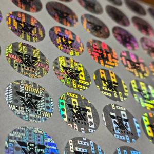 ฟิล์ม PET โฮโลแกรมสีเงินแบบกำหนดเองได้ ป้องกันการปลอมแปลง ฉลากกันน้ำ ป้องกันการงัดแงะ ฉลากบรรจุภัณฑ์สำหรับแบรนด์ต่างๆ - Product Image 1