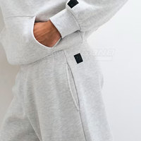 Survêtement à capuche uni et ample Performance, coupe confortable, tissu extensible 100% coton, léger et écologique pour le sport