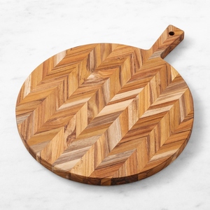 Planche à découper ronde en bois d'acacia avec un élégant motif en chevrons, poignée intégrée robuste, parfaite pour couper les légumes - Product Image 1