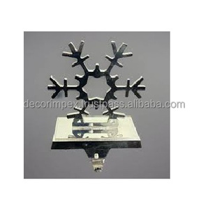 Snowflake <b>stocking</b> metal" primarily refers to decorative metal <b>stocking</b> <b>holders</b> featuring a snowflake design - Product Image 1