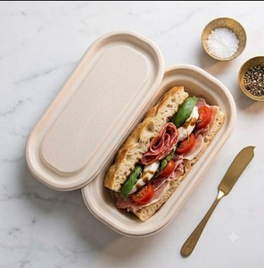 Eco-friendly 500ml oval food <b>container</b> made from bagasse comes with a lid fully compostable <b>microwave</b> safe and disposable. - Product Image 1
