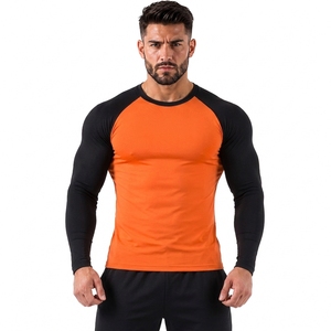 Camiseta Deportiva Unisex Naranja y Negra de Manga Larga, Secado Rápido, Spandex y Poliéster 260g, Estampado por Transferencia de Calor, Bloques de Color - Product Image 1