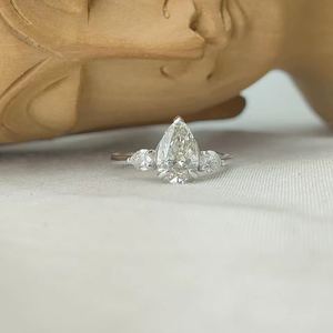 Pear Cut Diamond Ring Side <b>Stones</b> in White Gold a graceful blend of elegance and brilliance with radiant sparkle luxury - Product Image 1