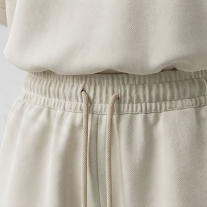 Ensemble décontracté en tricot 2 pièces pour femmes, t-shirt à manches courtes avec imprimé géométrique et short au-dessus du genou, coupe ample, vêtements de printemps et d'été - Product Image 5