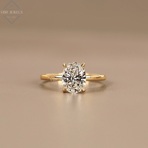 Anillo de compromiso de oro amarillo con diamante ovalado de lujo, banda minimalista, joyería nupcial, proveedor de regalos - Product Image 1