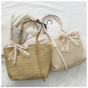 Capture the spirit of modern city life with this stylish Natural yarn bag featuring a structured <b>body</b> and an embroidered <b>bow</b> - Product Image 3