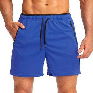 Shorts de sport bleus pour hommes à séchage rapide avec poches zippées, taille à cordon de serrage, longueur mi-cuisse, couleur unie, tissu tricoté - Product Image 1