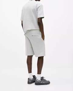 กางเกงขาสั้นผ้าฝ้ายแบบลำลองสำหรับผู้ชายระบายอากาศได้ดีเป็นมิตรกับสิ่งแวดล้อมมีสายรูดปิดยาวถึงเข่าลายทึบ XS XXS - Product Image 2