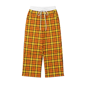 Pantalon de détente large jaune et noir à carreaux pour femme, avec taille élastique blanche, cordon de serrage et poches latérales, idéal pour la tenue décontractée ou comme bas de pyjama. - Product Image 4