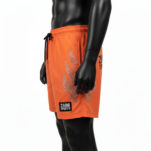 Pantalones cortos premium de nailon de secado rápido de 220 GSM para hombre, color naranja brillante, con logotipo de diamantes de imitación termotransferibles y parche personalizado. - Product Image 3