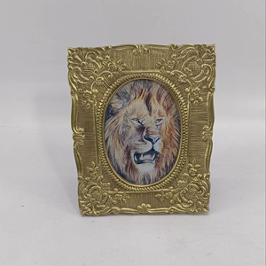 Decorative metal photo <b>frame</b> with <b>antique</b> brass finished and intricate floral designs perfect for elegant interiors - Product Image 1