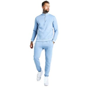 Survêtement pour homme bleu clair à demi-zip, manches longues, coupe classique, couleur unie, vêtement décontracté avec poches latérales. - Product Image 1