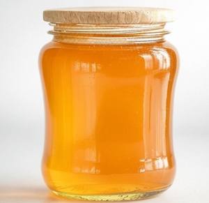 Miel multifloral cruda natural textura gruesa brillo dorado empaquetado limpio para pedidos a granel y uso diario en la cocina del hogar - Product Image 2