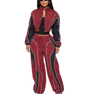 เสื้อแจ็กเก็ตและกางเกงกันลมผ้าไนลอนน้ำหนักเบาสำหรับผู้หญิงพิมพ์ลายแนวสตรีทเสื้อกันลมชุดวอร์มฤดูหนาว - Product Image 1