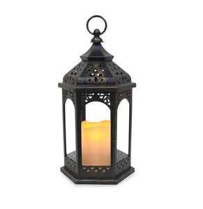 Hexagonal metal <b>lantern</b> pair ornate geometric lattice cutout domed top golden interior <b>black</b> exterior warm glowing light indoor - Product Image 2
