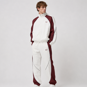 Survêtement color block de haute qualité avec logo brodé personnalisé, veste coupe-vent imperméable à fermeture éclair intégrale et pantalon de survêtement à empiècements contrastants - Product Image 1