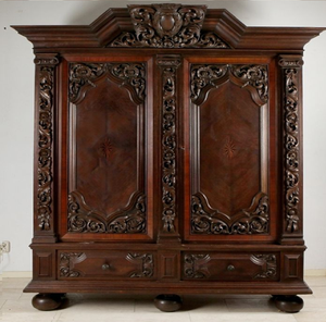 Antique dark wood wardrobe with ornate scroll accents and bottom storage drawers, available at wholesale prices. - Product Image 1