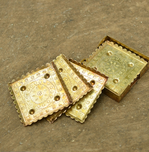 Unique textured brass coasters with subtle dark highlights and raised rim, available at wholesale prices. - Product Image 6