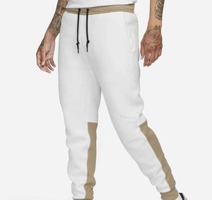 Pantalon de survêtement en molleton blanc pour homme avec empiècements latéraux beiges, taille élastique et cordon de serrage, style décontracté, idéal pour l'automne - Product Image 1