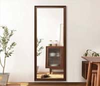 Dramatic live-edge mirror highlighting organic, raw wooden contours and gorgeous textures. Available at wholesale price.