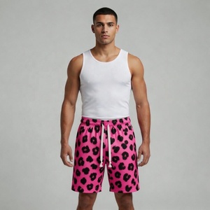 Shorts en maille unisexe Pro Performance rose vif à imprimé guépard par sublimation, tenue décontractée avec motif animalier audacieux et cordon de serrage ajustable - Product Image 1