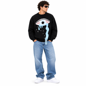 Suéter de punto oversize negro para hombre con gráfico de ojos y diseño de lágrimas azules, cuello redondo, estilo urbano. - Product Image 1