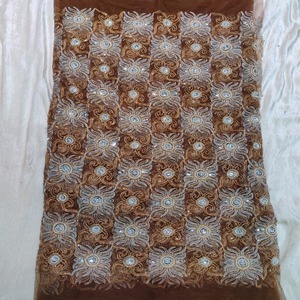 The Timeless Tradition Latest Fashion Nigerian Net Lace Mesh Fabric With High- Quality Stone Beaded Work On Floral Pattern - Product Image 1