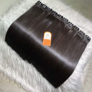 Prêt à expédier des extensions de cheveux humains non transformés de donneur brut vietnamien droit d'os de couleur noire Machine à Double trame de paquets de cheveux - Product Image 1