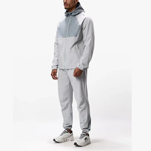Survêtement gris clair pour homme, à blocs de couleur, manches longues, à capuche, avec fermeture éclair, sportif, respirant, en polyester, coupe classique, pour le printemps - Product Image 1