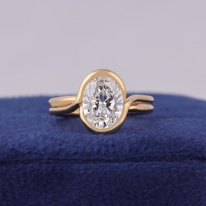 แหวนหมั้นเพชรรูปไข่เพาะเลี้ยงแบบ Bypass Solitaire ทองคำ 14k สีเหลือง หรูหรา ได้รับการรับรองจาก IGI เครื่องประดับที่สวยงามและยั่งยืน - Product Image 1