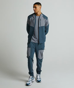 Conjunto de Chaqueta Cortavientos Sólida Personalizada para Hombre, Venta al por Mayor, Chándal Personalizable con Cordón Ajustable, Ropa Deportiva de Poliéster Suave para Gimnasio y Running - Product Image 1