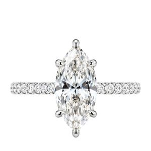 Elegant marquise solitaire ring in 18K white gold with prong set marquise diamond slim band pave round diamonds couture - Product Image 1