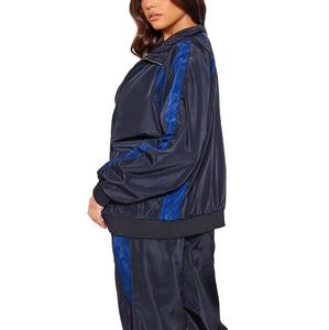 Trajes de ropa deportiva de marca con logotipo bordado personalizado, chándal de bloque de color con cremallera, chándal de nailon cortavientos de mejor diseño para mujer - Product Image 2