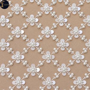 Tissu à paillettes florales avec motifs de fleurs blanches et lignes perlées |   Tissu en maille décoratif pour robes de mariée et tenues de soirée - Product Image 1
