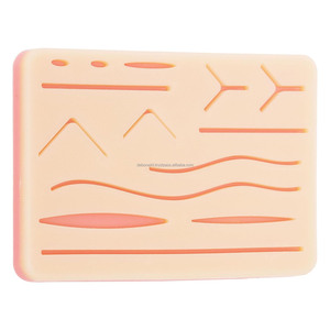 Almohadilla de Práctica de Sutura con 14 Heridas de Silicona Pre-cortadas para Educación Médica y Simulación Quirúrgica en Universidades - Product Image 1
