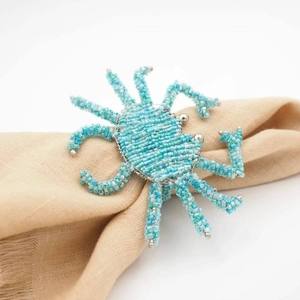 Anneau de serviette artisanal tissé en perles de couleur turquoise, élégant et fait main, pour la décoration de table nautique de luxe lors de mariages et banquets côtiers - Product Image 1