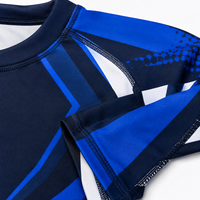 Maillot de compression unisexe à manches longues en polyester et élasthanne respirant 140g, motif graphique bleu, pour entraînement MMA et lutte, personnalisable