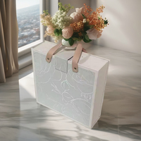 Boîte cadeau en EVA de luxe en forme de livre, avec logo en feuille d'or, texture gaufrée élégante, laminage mat pour crème pour le visage, produits de luxe personnalisés